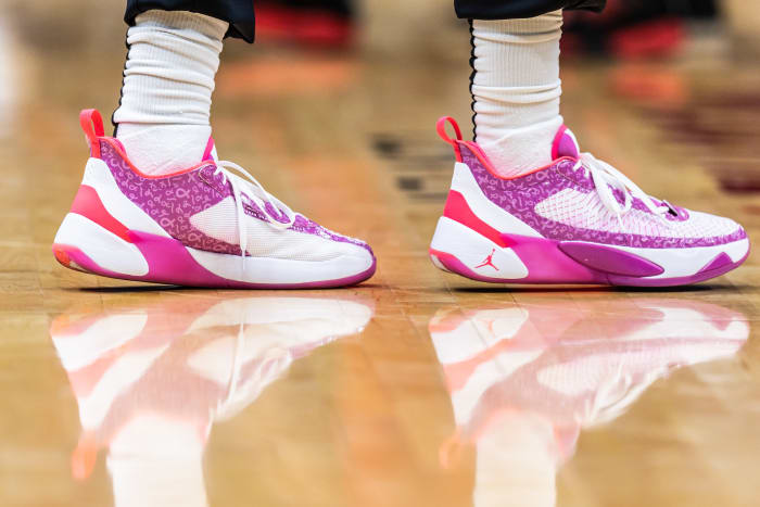 View of white and pink Jordan Luka shoes.